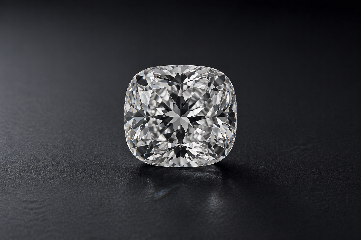 Principal cushion-cut white diamond on black velvet